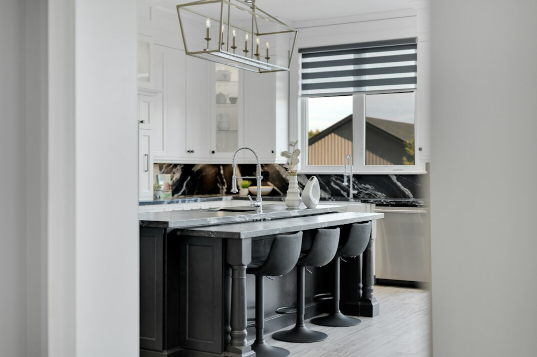Editorial desk with design magazines, a lamp and archive photographs