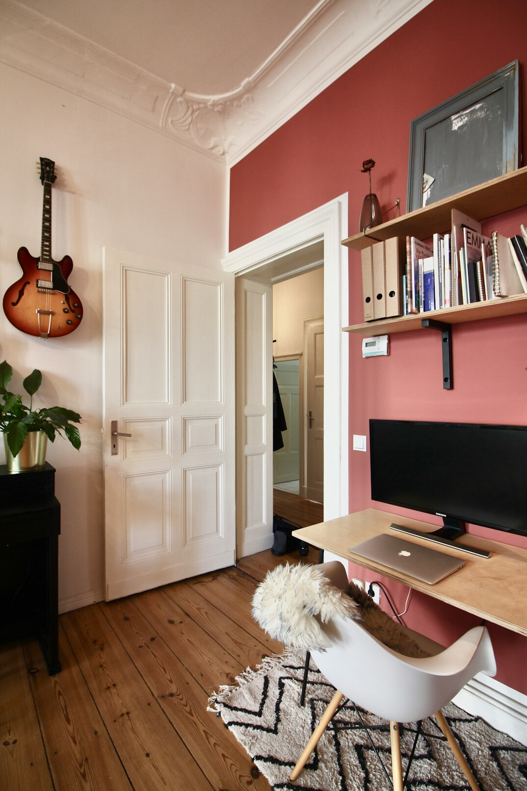 Vintage home office with wooden desk and bookshelves