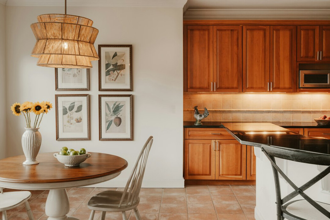 Vintage kitchen interior with wooden cabinets and tiled floor