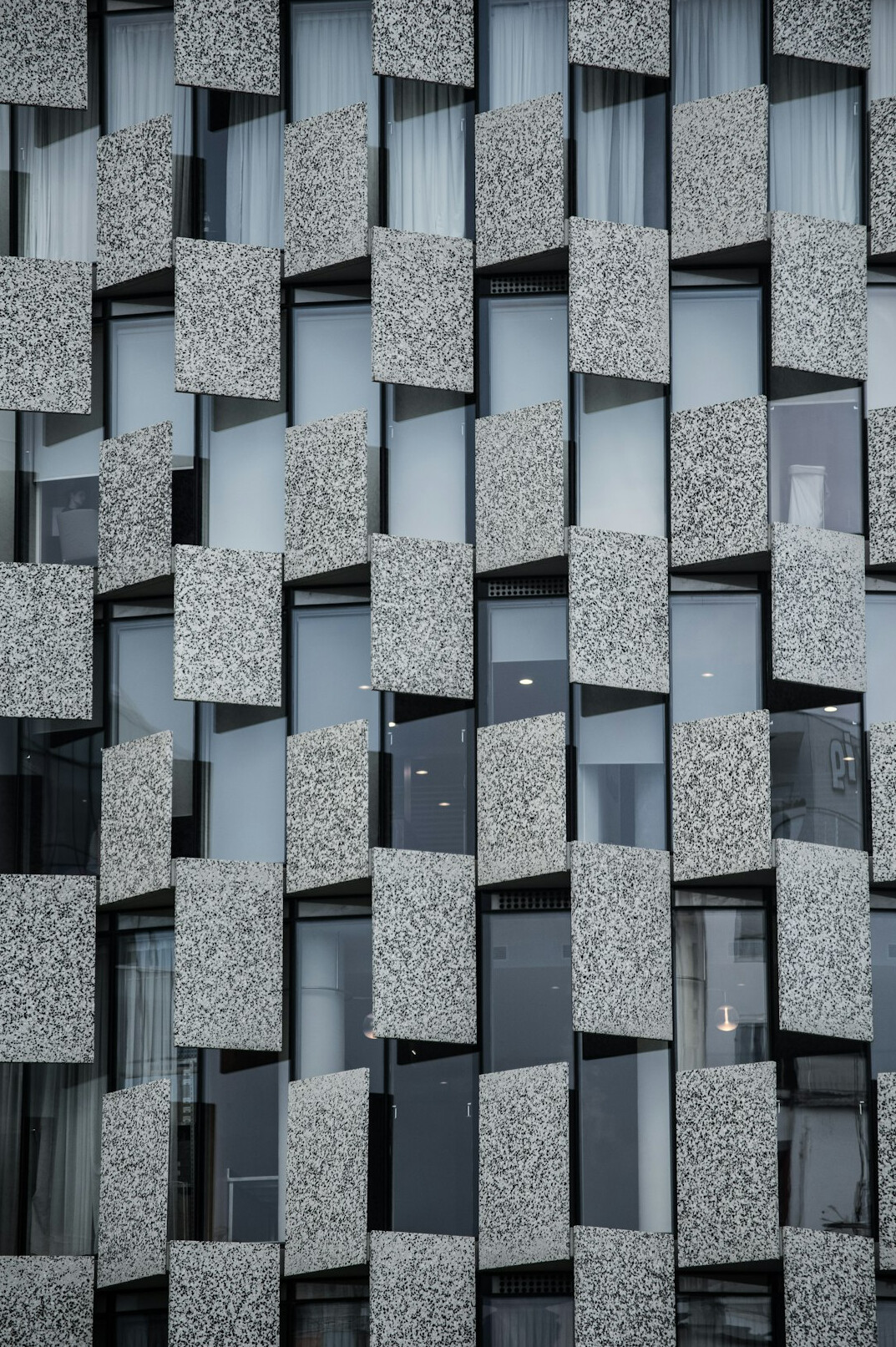 Modern architectural facade with geometric lines and glass